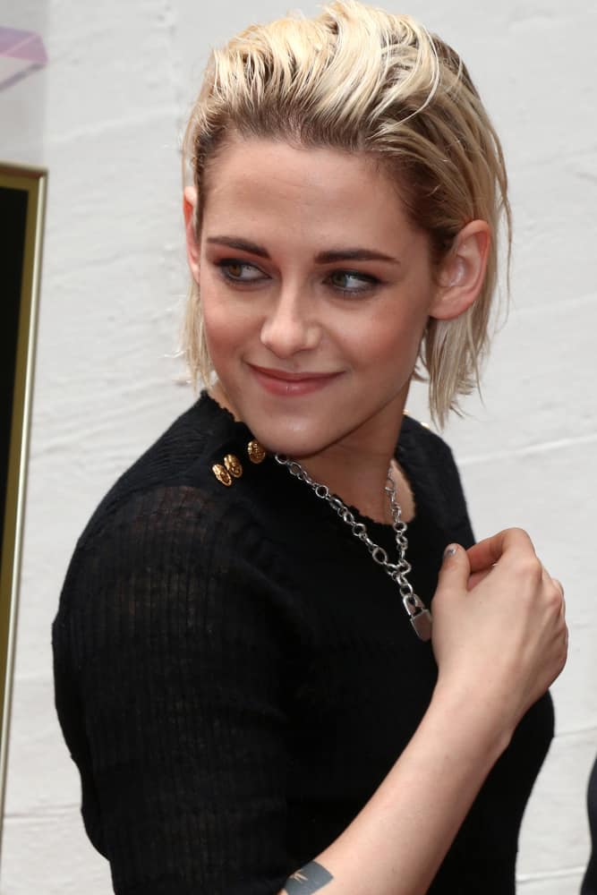 Kristen Stewart having her short blonde bob hairstyle brushed up attends the Jodie Foster Hollywood Walk of Fame Star Ceremony 2016