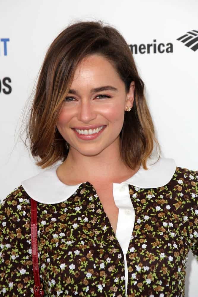 Emilia Clarke in her straight bob hairstyle at the 2016 Film Independent Spirit Awards. She looks quite youthful yet sophisticated with her collared floral dress and bob hairstyle.