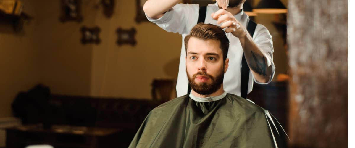 Man getting haircut at barber