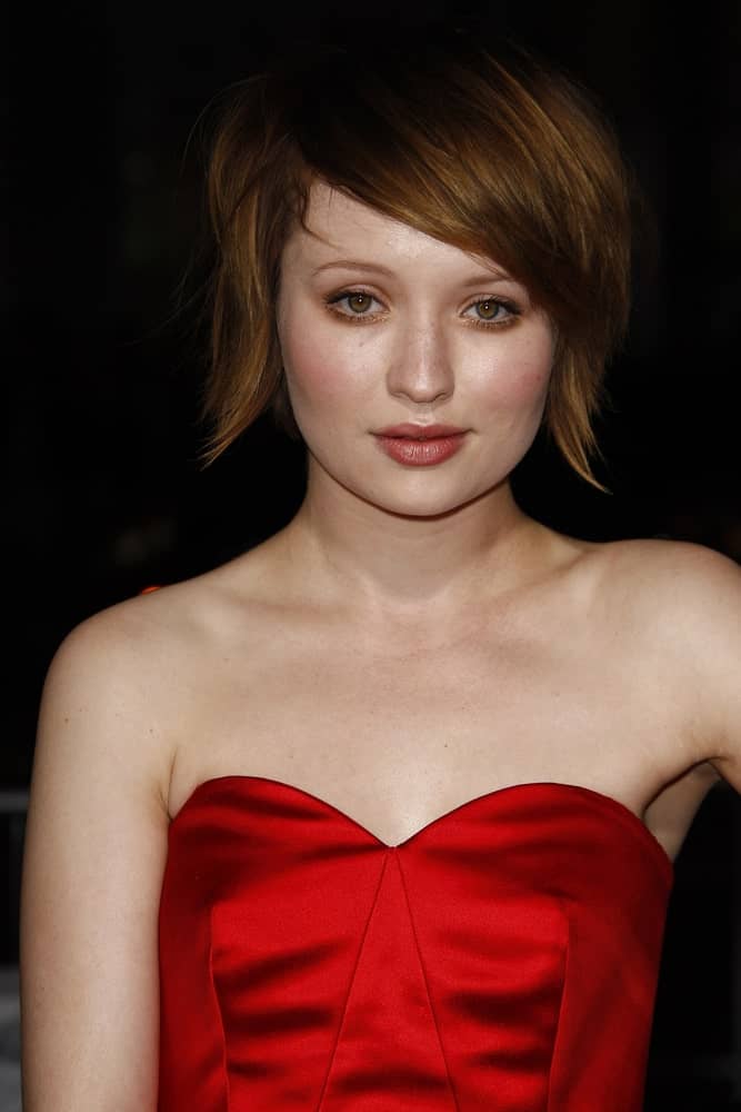 Emily Browning was at the premiere of 'Red Riding Hood' on March 7, 2011 at the Grauman's Chinese Theater in Los Angeles, California. She wore a red strapless dress with her chin-length brunette hairstyle that has long side-swept bangs.