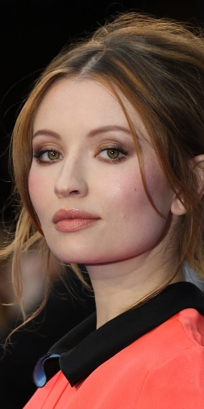 Emily Browning attended the Legend UK film premiere on September 3, 2015 in London. She wore an elegant dress to pair with her messy brunette bun hairstyle that has long side-bangs and tendrils.