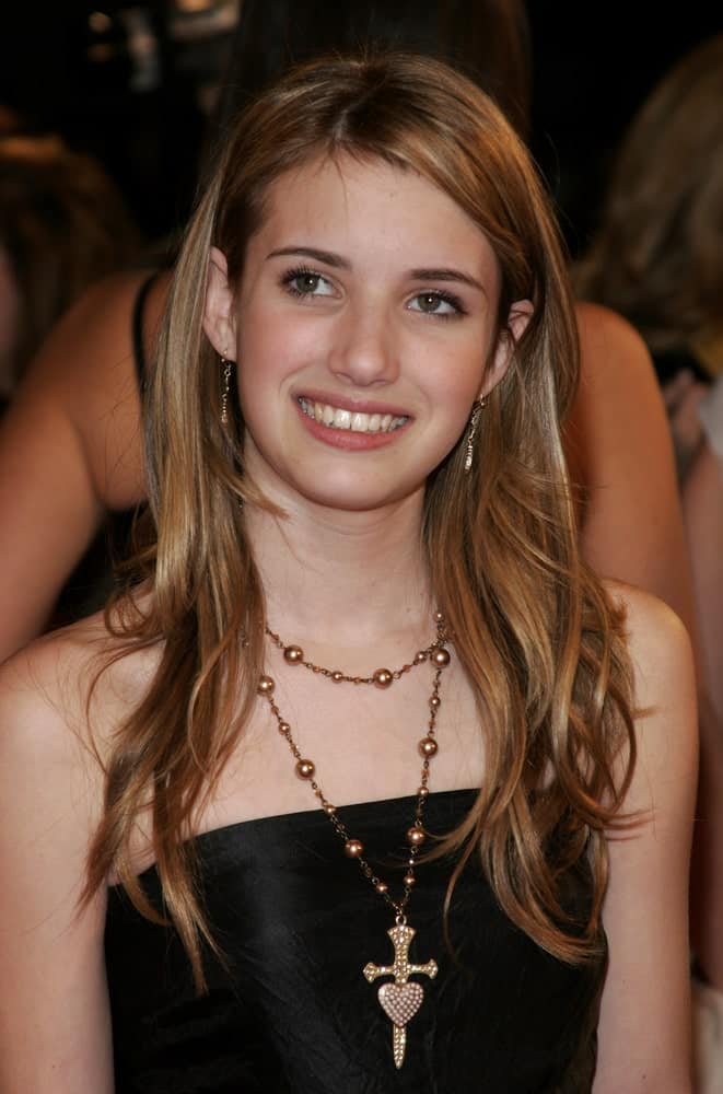 On December 6, 2005, Emma Roberts attended the "The Family Stone" Los Angeles Premiere at the Mann Village Theater in Westwood, California. She was seen wearing a black dress with her long and layer brunette hairstyle that is slightly tousled.