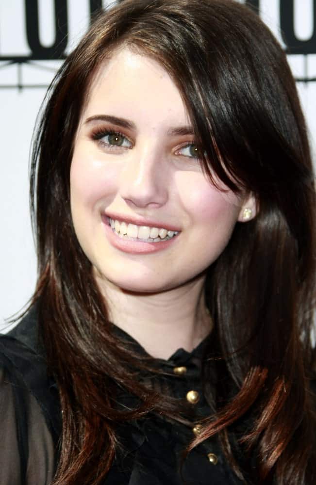 Emma Roberts attended the world premiere of 'Kit Kittredge: An American Girl' at the Grove in Los Angeles, California on June 14, 2008. She wore a black dress with her long dark hairstyle that has layers and long side-swept bangs.