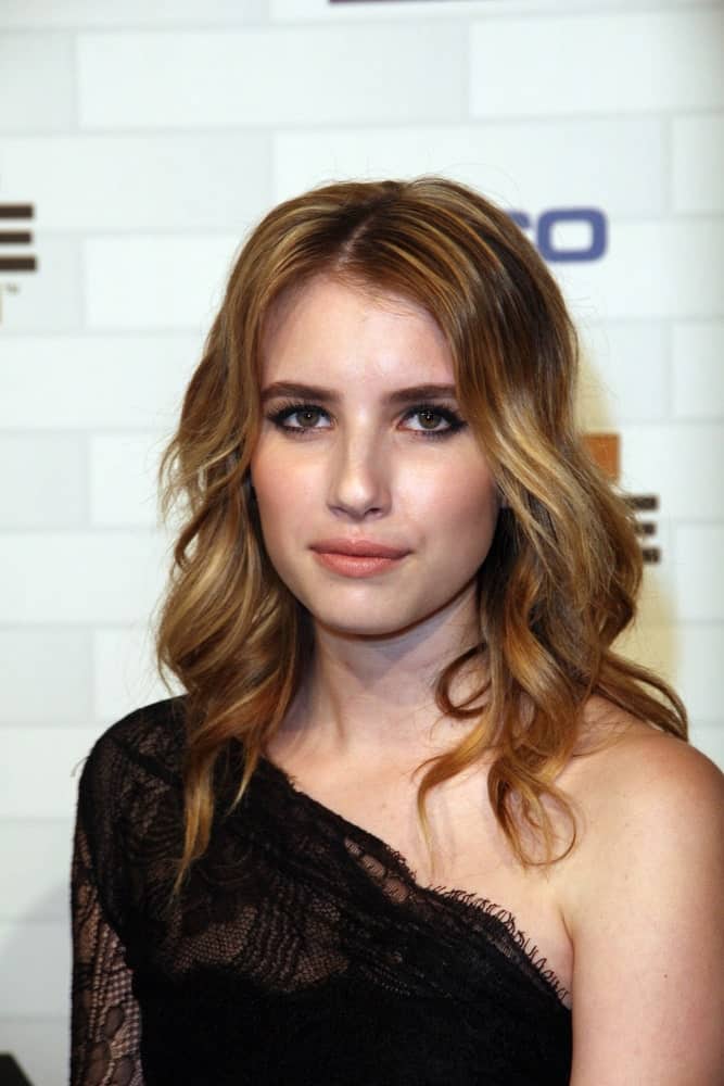 Emma Roberts attended the Spike TV's "Scream 2010," Greek Theater, Los Angeles, CA on October 16, 2010. She was lovely in a black dress with a long and tousled wavy brunette hairstyle with layers.