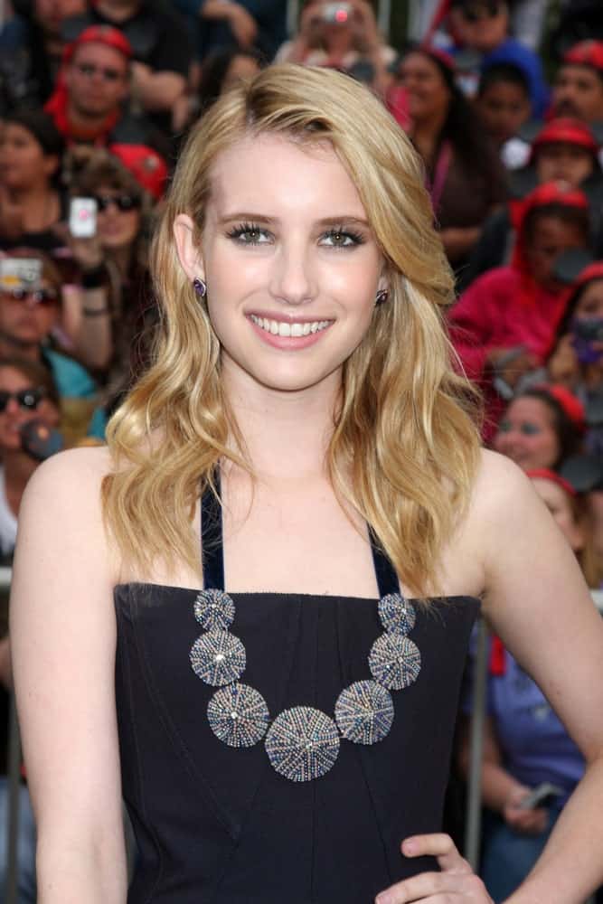 Emma Roberts attended the "Pirates of The Caribbean: On Stranger Tides" World Premiere at Disneyland on May 7, 2011 in Anaheim, CA. SHe wore a strapless black dress with her long and tousled sandy-blonde wavy layers with long side-swept bangs.