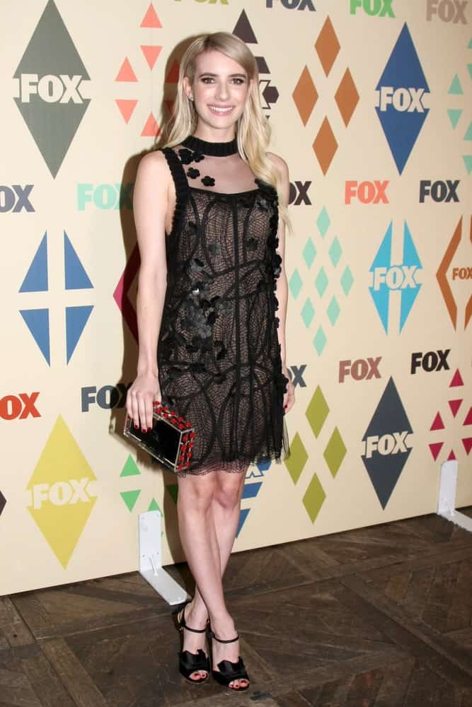 Emma Roberts attended the FOX Summer TCA All-Star Party 2015 at the Soho House on August 6, 2015 in West Hollywood, CA. She was seen wearing a black dress with her long and loose tousled blonde hairstyle tucked behind her ears.