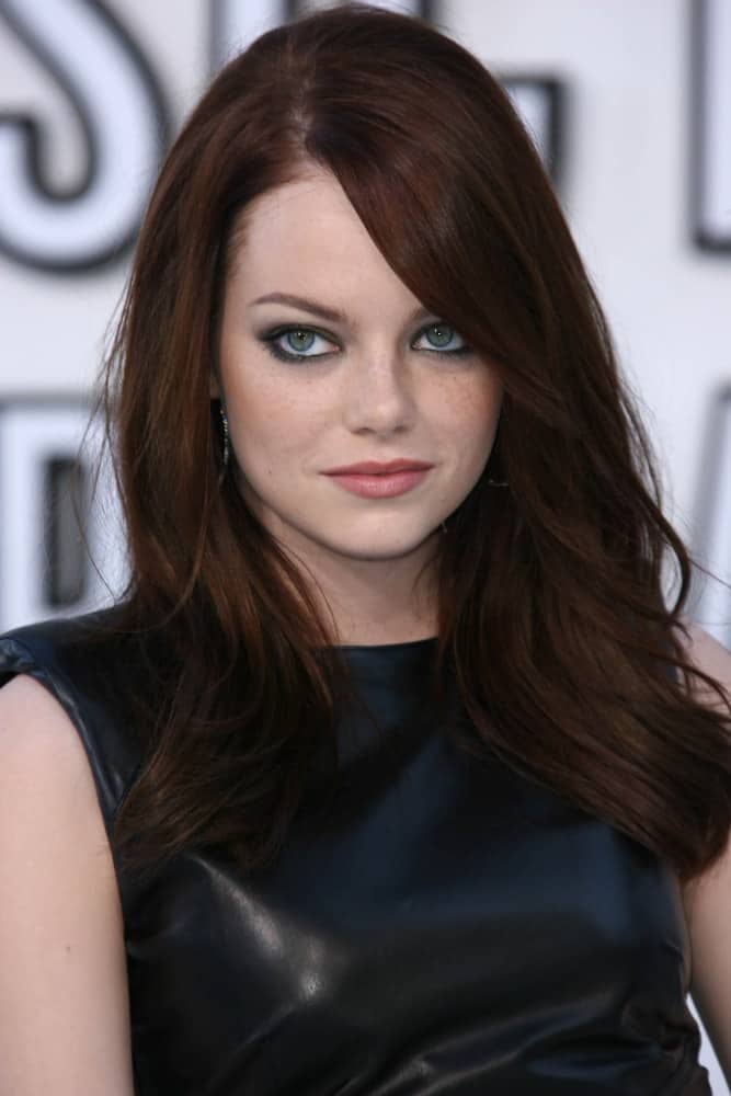 On August 12, 2010, Emma Stone's mesmerizing eyes were emphasized by her dark straight hair with long side-swept bangs at the 2010 MTV Video Music Awards, Nokia Theatre L.A. LIVE in Los Angeles, CA.
