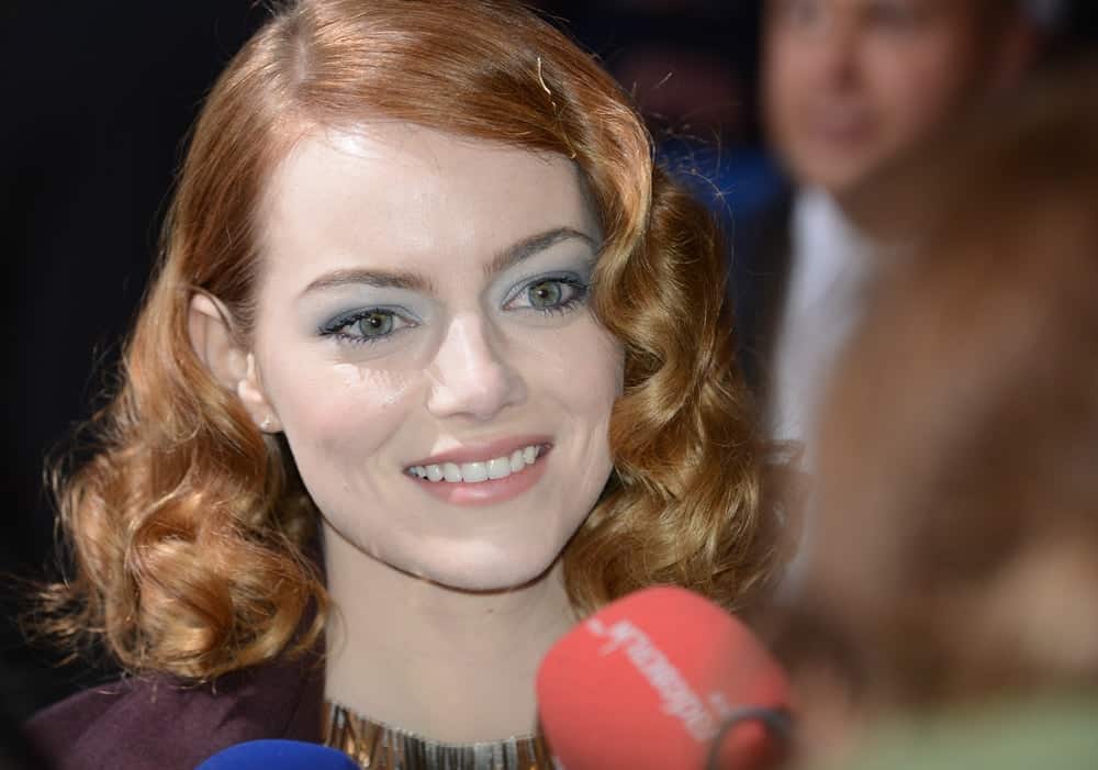 Emma Stone was at "The Amazing Spider-Man 2" premiere at CineStar, Sony Center, Potsdamer Platz on April 15, 2014 in Berlin, Germany. She was stunning with her short and curly pinned hairstyle and bright smile.