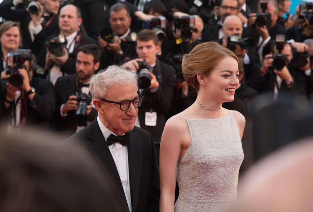 Woody Allen and Emma Stone attended the 'Irrational Man' premiere during the 68th annual Cannes Film Festival on May 15, 2015 in Cannes, France. Stone was a picture of elegance in her simple white dress and upstyle hair that has highlights.