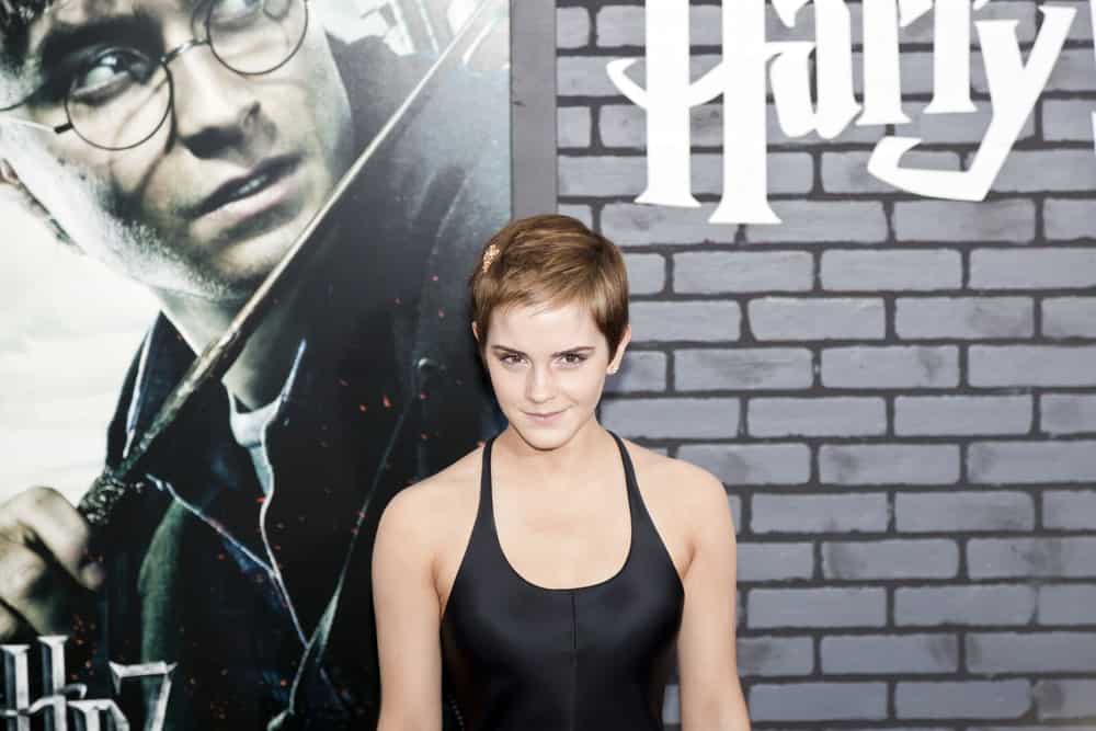 Actress Emma Watson attended the premiere of 'Harry Potter and the Deathly Hallows: Part 1' at Alice Tully Hall on November 15, 2010 in New York City. She was wearing a silky black dress that she paired with her short pixie hairstyle that has short bangs.