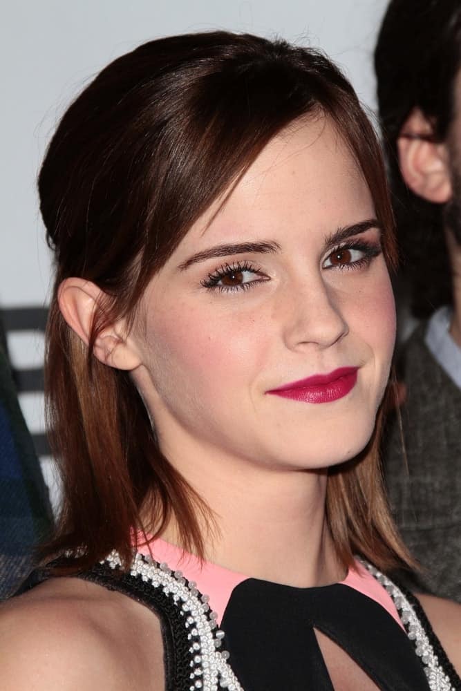 Emma Watson paired her colorful dress with a shoulder-length half-up hairstyle with side-swept bangs at the 2013 People's Choice Awards Press Room, Nokia Theatre in Los Angeles, CA on January 9, 2013.