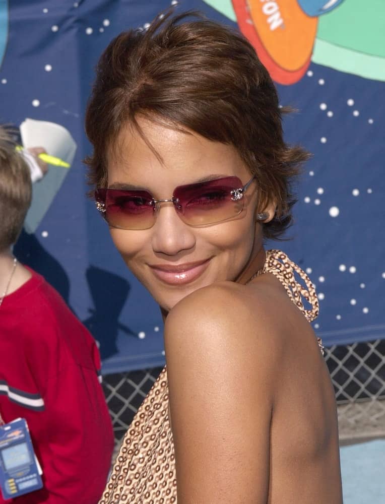 Actress Halle Berry wore a casual patterned summer dress with her cool sunglasses and pixie hairstyle with short bangs at the Nickelodeon's 14th Annual Kid's Choice Awards on April 21, 2001 in Santa Monica, CA.