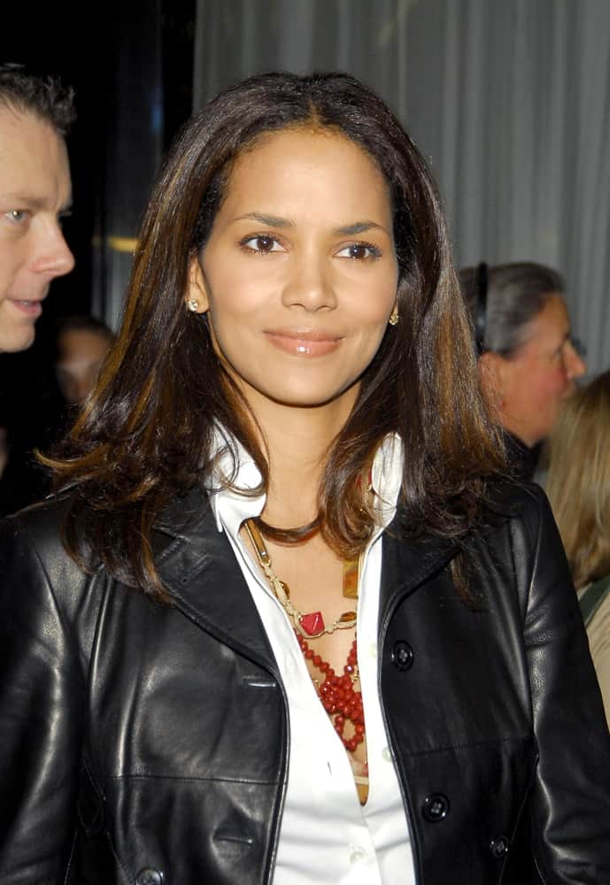 Halle Berry wore a black leather jacket over her white button down shirt medium-length straight hair with highlights at the "Thank You for Smoking" Premiere held at The Museum of Modern Art, MoMA in New York, NY on March 12, 2006.