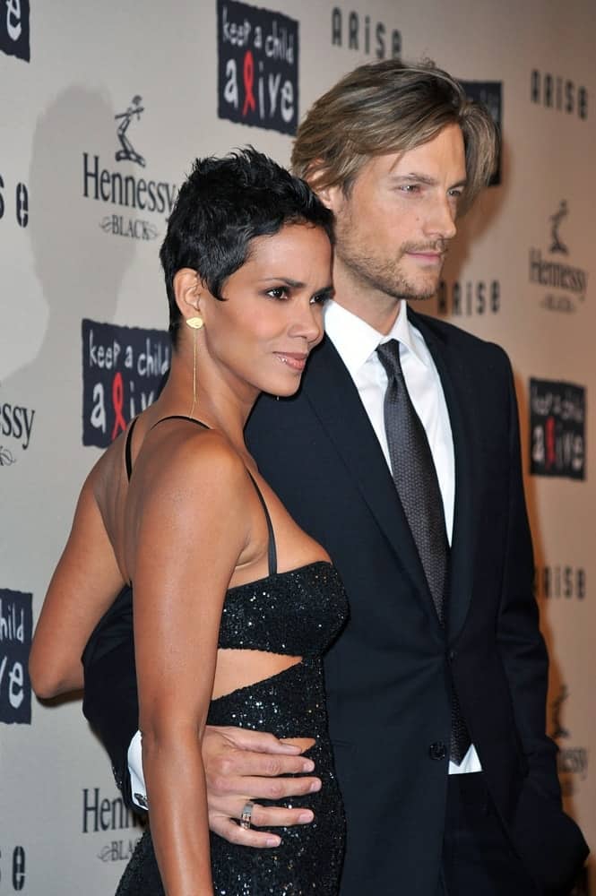 Halle Berry and Gabriel Aubry were at Keep a Child Alive 6th Annual Black Ball Fundraiser, Hammerstein Ballroom in New York, NY on October 15, 2009. They wore matching black outfits with Berry topping it off with a spiked pixie hairstyle to her raven hair.