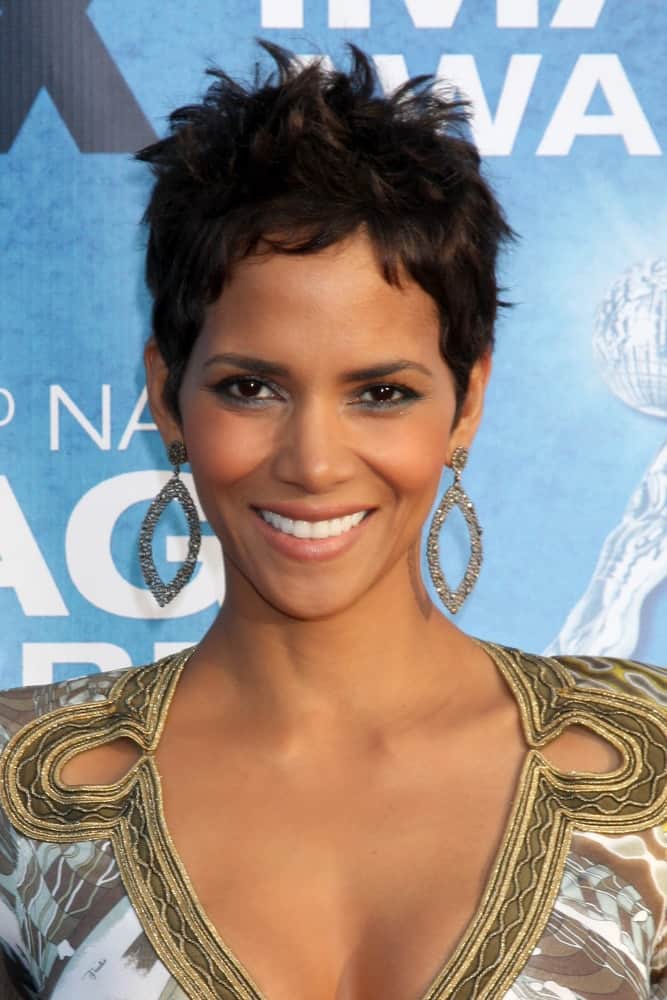 Halle Berry's awesome earrings perfectly match her dress spiked pixie hairstyle when she arrived at the 42nd NAACP Image Awards at Shrine Auditorium on March 4, 2011 in Los Angeles, CA.