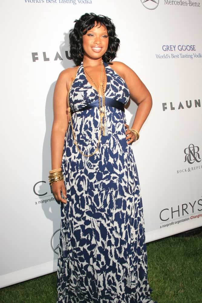 Jennifer Hudson was at the Chrysalis Butterfly Ball at a private mansion, Los Angeles, California on June 2, 2007. She wore a sundress with her shoulder-length curly hairstyle with a slight tousle.