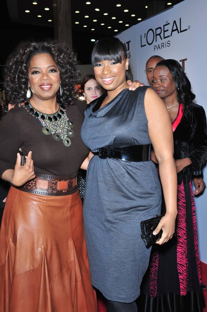 Jennifer Hudson & Oprah Winfrey were at the Los Angeles premiere of "The Great Debaters" at the Cinerama Dome, Hollywood on December 11, 2007. Hudson paired her black dress with a straight raven ponytail hairstyle with blunt bangs.