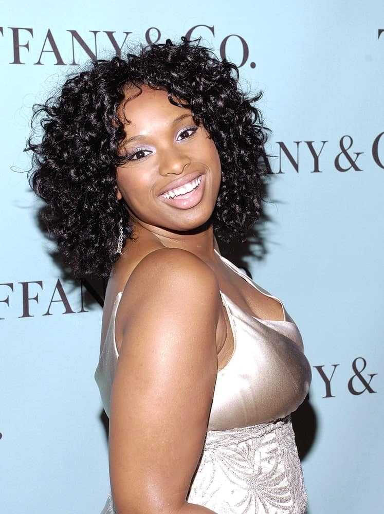 Jennifer Hudson was at the Launch of the Tiffany 2008 Blue Book Collection at the American Museum of Natural History in New York, NY on October 27, 2007. She paired her golden dress with a loose and tousled shoulder-length curly hairstyle.