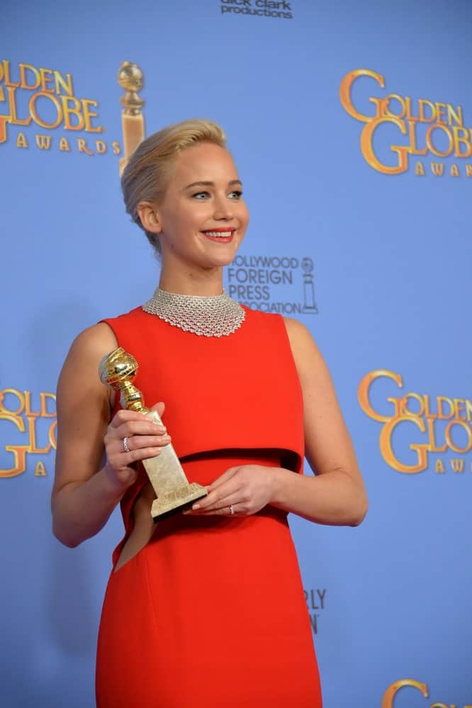 On January 10, 2016, Jennifer Lawrence was brimming with pride as she held her trophy at the 73rd Annual Golden Globe Awards at the Beverly Hilton Hotel. She wore an elegant red dress that she paired with a slick upstyle and bright smile.