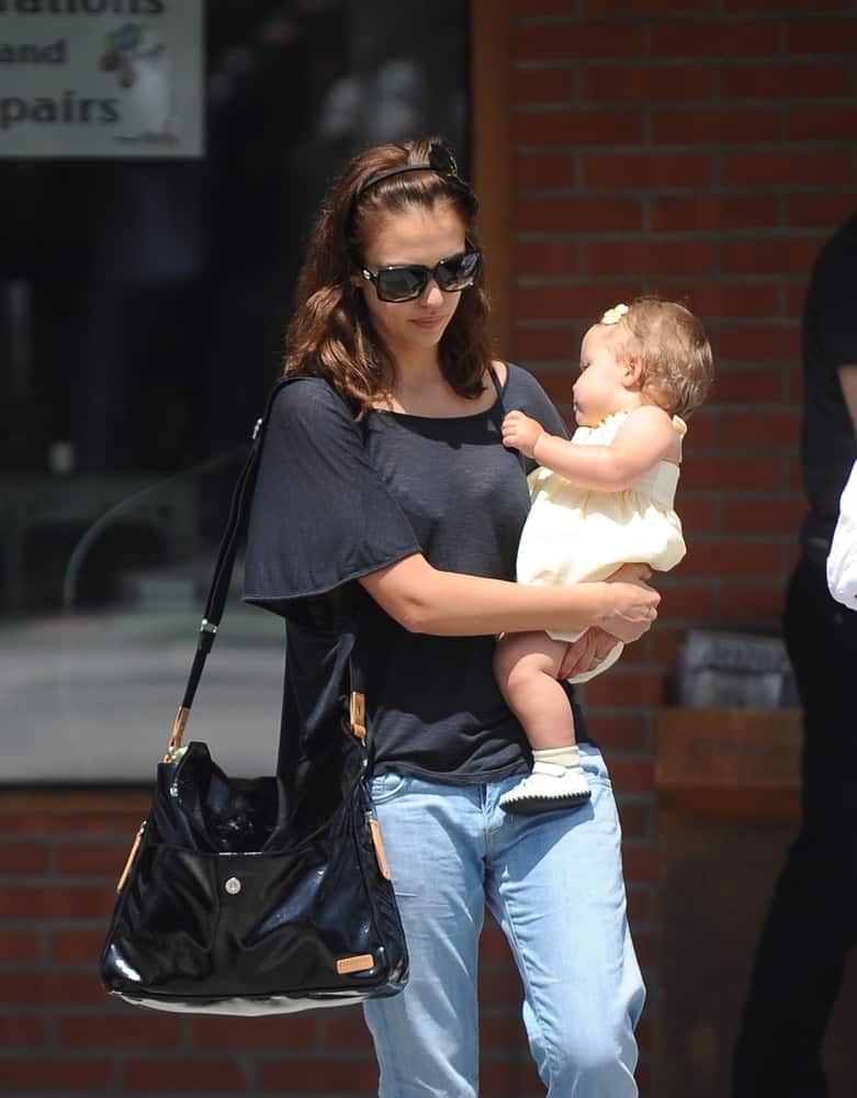 Jessica Alba and her daughter, Honor Marie Warren were see walking the streets of Beverly Hills on May 15, 2009. Alba was wearing a relaxed casual outfit with her cool sunglasses and tousled loose brown hairstyle with a headband and layers.
