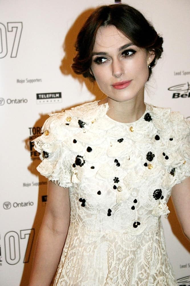 Keira Knightley was at the Premiere of Silk at the 32nd Annual Toronto International Film Festival, Elgin Theatre VISA Screening Room, Toronto on September 11, 2007. She came in a detailed white dress that she paired with her messy low bun hairstyle with a center part.
