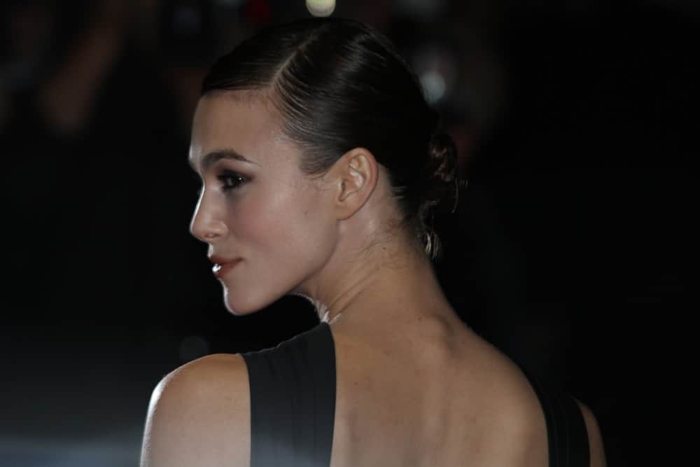 Keira Knightley attended the Premiere of 'A Dangerous Method' during the 55th BFI London Film Festival at Odeon West End on October 24, 2011 in London. She was seen wearing a black dress with her slick low bun hairstyle.
