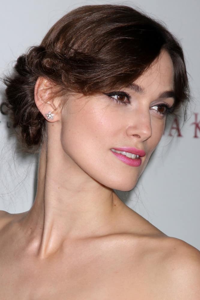 Keira Knightley attended the 'Anna Karenina' Los Angeles Premiere at ArcLight Hollywood on November 14, 2012 in Los Angeles, CA. She was seen wearing a strapless dress with her braided upstyle bun hairstyle.