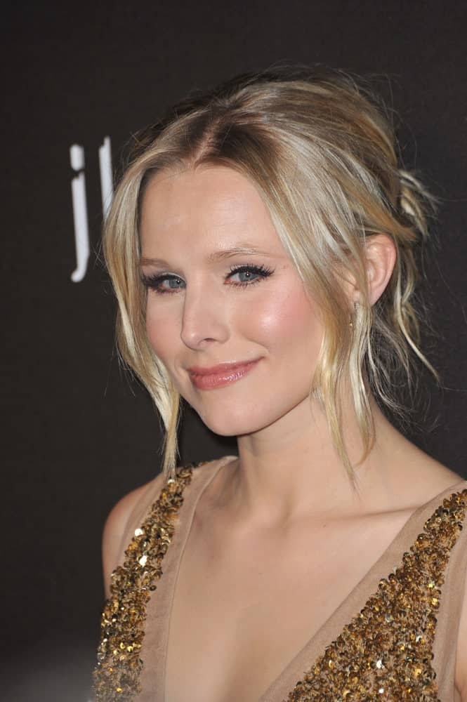 Kristen Bell with her blonde locks arranged into a messy upstyle with loose tendrils at the 12th Annual Costume Designers Guild Awards at the Beverly Hilton Hotel on February 25, 2010.