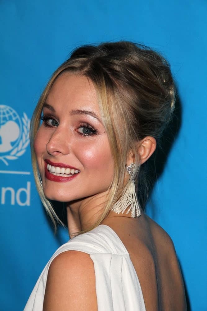 Kristen Bell looked lovely in a glam updo with tendrils at the 2011 Unicef Ball held on December 8, 2011, in Beverly Wilshire Hotel, Beverly Hills, CA.
