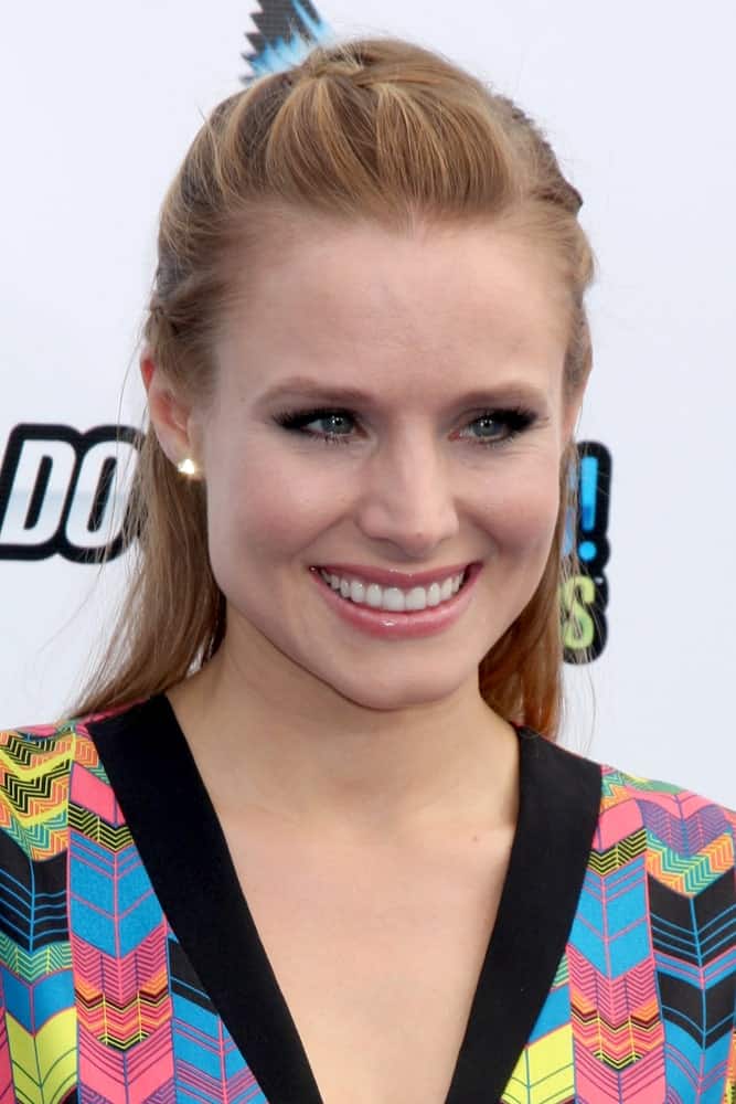 Kristen Bell opted for a braided half-updo during 2012 Do Something Awards at Barker Hanger on August 19, 2012. She completed the look with a colorful geometric dress and stud earrings.
