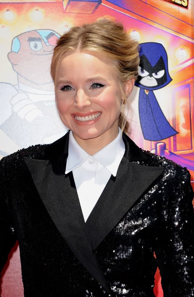 Kristen Bell was seen at the Los Angeles premiere of 'Teen Titans Go! To The Movies' held at the TCL Chinese Theatre IMAX on July 22, 2018, rocking a center-parted upstyle with side tendrils.