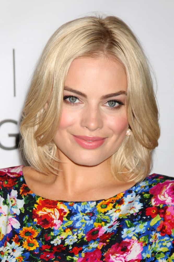 Margot Robbie wore a colorful floral dress along with her short blonde center-parted hair at the Disney/ABC Television Group Summer Press Tour at the Beverly Hilton Hotel on August 7, 2011.