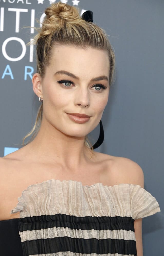 Margot Robbie rocked a stylish twisted top knot during the 23rd Annual Critics' Choice Awards held at the Barker Hangar in Santa Monica, USA on January 11, 2018.