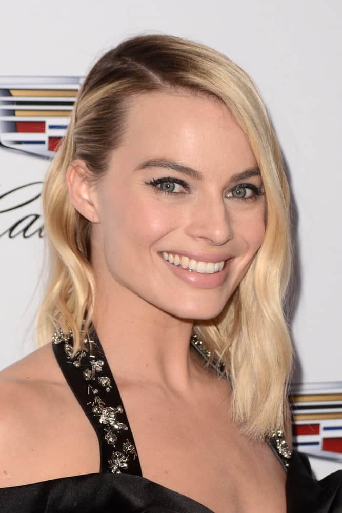 Margot Robbie with her short loose hair pinned to one side at the Producers Guild Awards 2018 held at the Beverly Hilton Hotel on January 20, 2018.