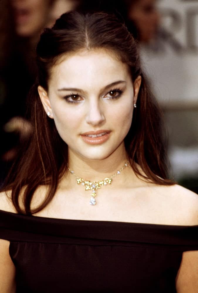 Natalie Portman's medium-length dark hair was styled into a lovely straight half-up hairstyled to match her black off-shoulder outfit at the Golden Globe Awards back in January of 2000.