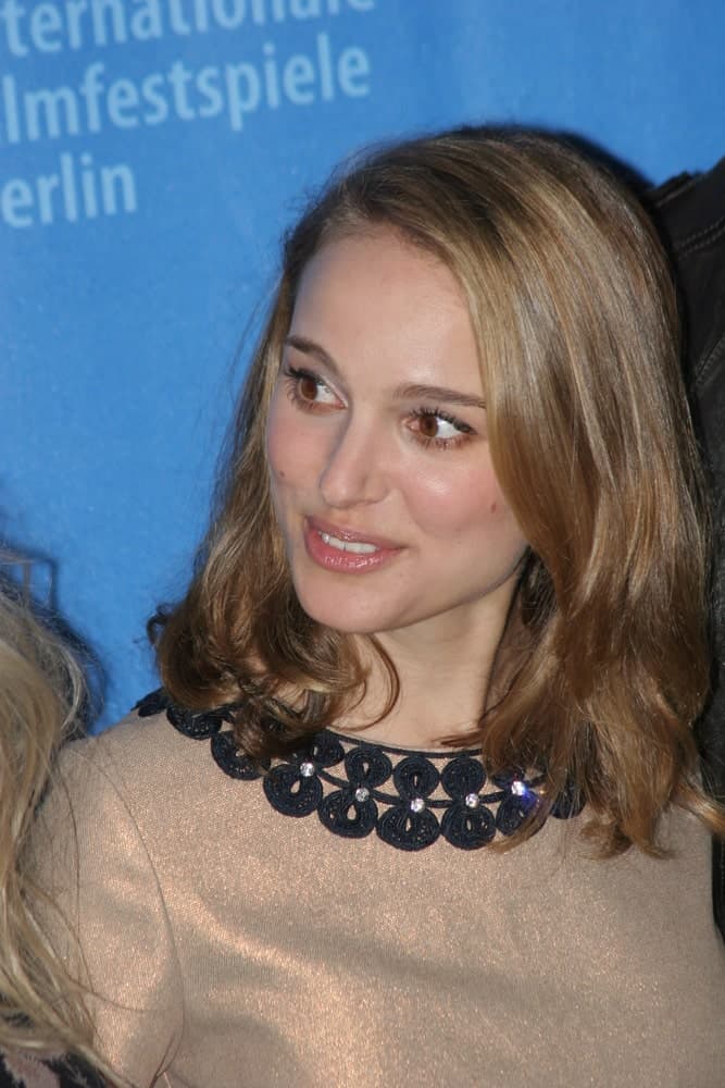 Actress Natalie Portman attended the 'The Other Boleyn Girl' Photocall as part of the 58th Berlinale Film Festival at the Grand Hyatt Hotel on February 15, 2008 in Berlin, Germany. Her simple silvery dress paired quite well with her loose shoulder-length brown hair with layers.