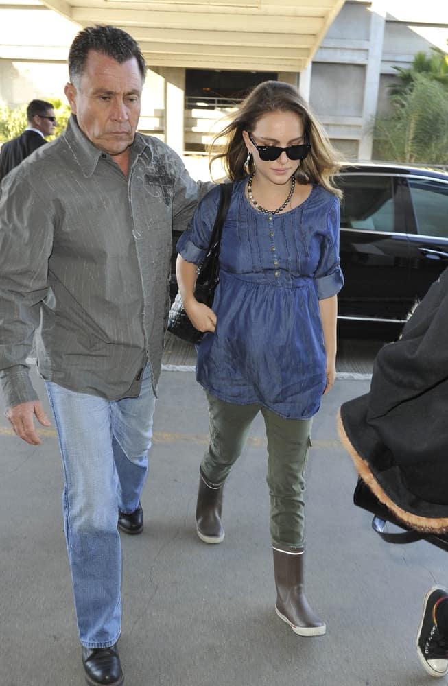 Actress Natalie Portman was seen at LAX on February 7, 2011 in Los Angeles, California. She paired her casual outfit with a pair of cool sunglasses and loose brunette hairstyle with a tousled side-swept finish.