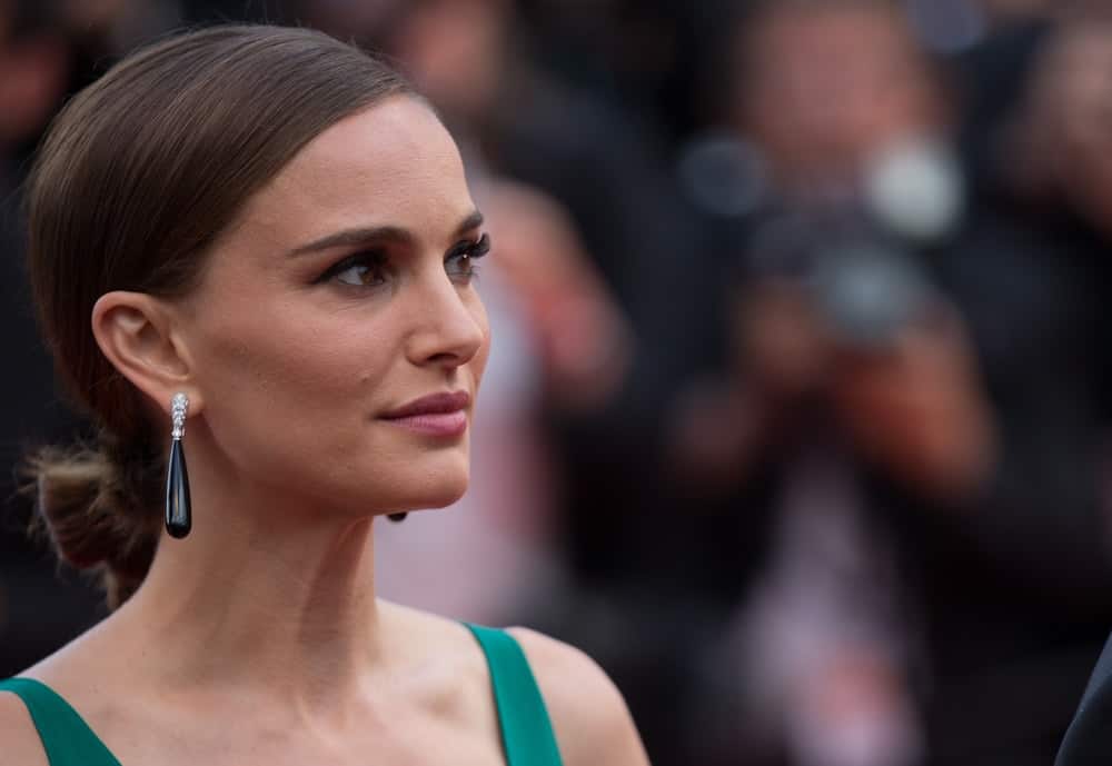 Natalie Portman and guests attended the 'Sicario' Premiere during the 68th annual Cannes Film Festival on May 19, 2015 in Cannes, France. She paired her green dress and gorgeous black earrings with a charming dark low bun hairstyle.