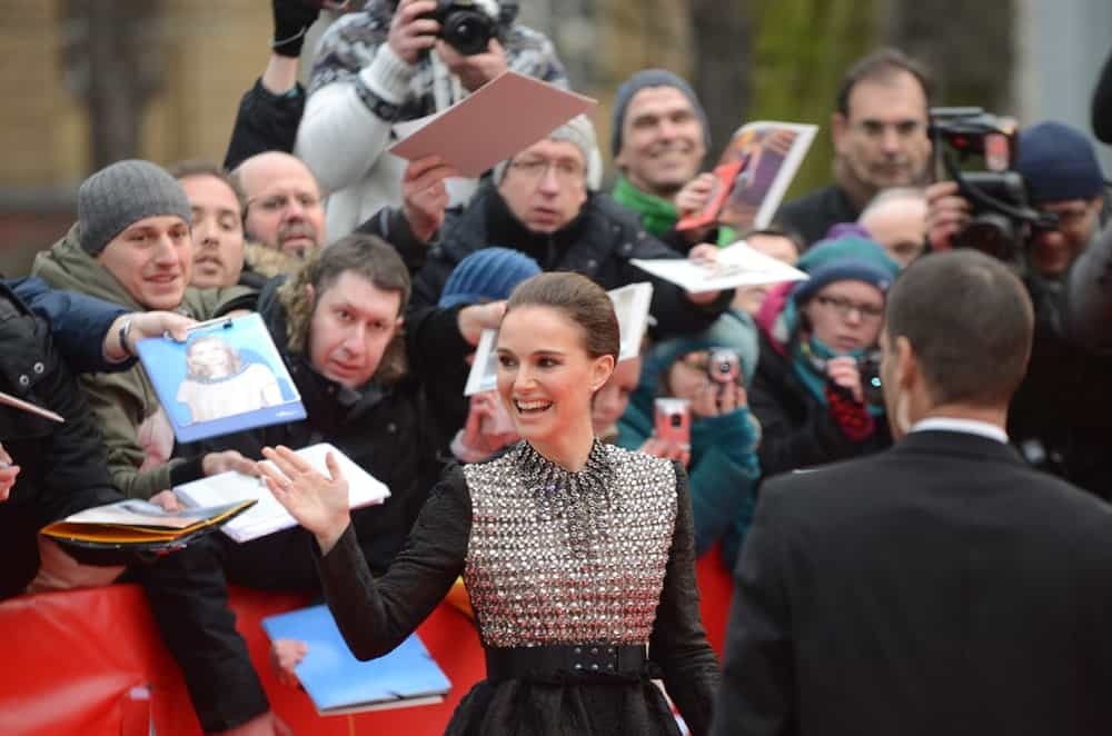 Natalie Portman greeted her fans at the 65rd Annual Berlinale International Film Festival "The Seventh Fire" at Haus der Berliner Festspiele on February 7, 2015 in Berlin, Germany. She wore a lovely black and silver dress with her slick bun hairstyle.