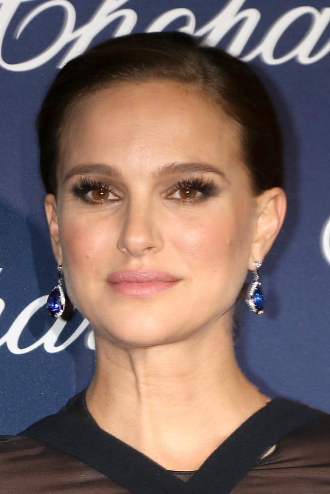 Natalie Portman's lovely blue earrings were on full display with her black dress and slick bun hairstyle at the Palm Springs International FIlm Festival Gala at Palm Springs Convention Center on January 2, 2017 in Palm Springs, CA.