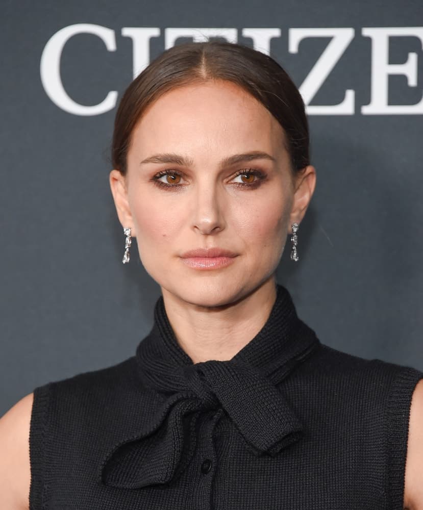 Natalie Portman attended the "Avengers: End Game" Los Angeles Premiere on April 22, 2019 in Los Angeles, CA. She went with a simple yet elegant look to her black sleeveless outfit and slick bun hairstyle to emphasize her gorgeous earrings.