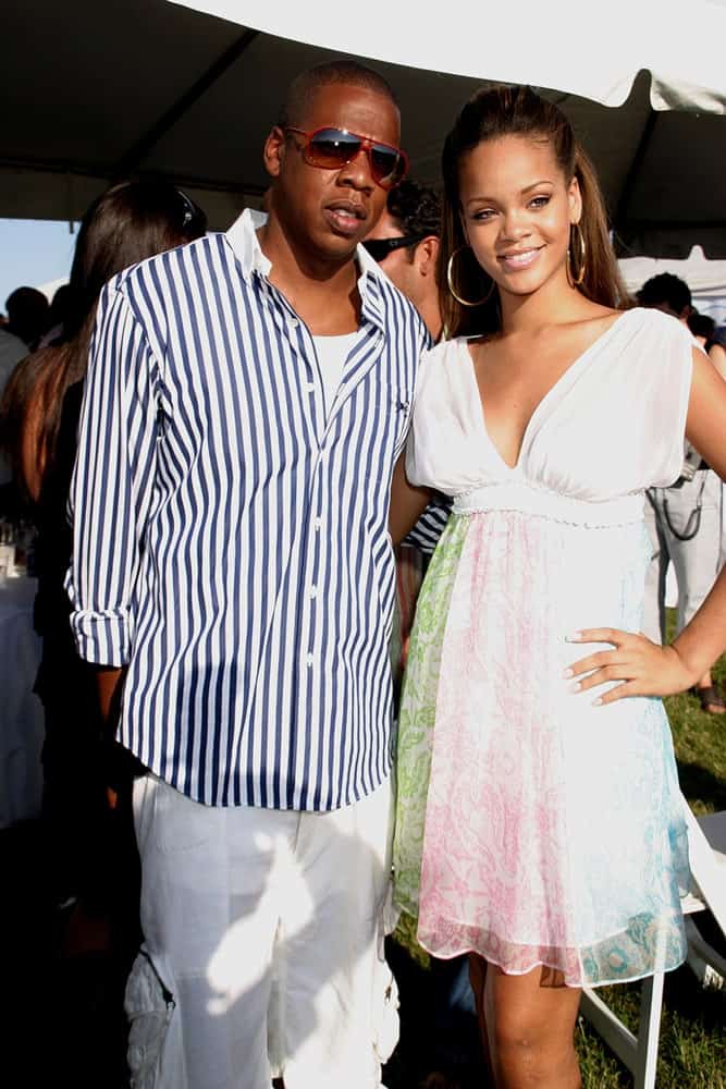 Jay Z and Rihanna were at the 2005 Mercedes-Benz Polo Challenge, The Bridgehampton Polo Club BPC in Bridgehampton, NY on July 23, 2005. She wore a lovely short sun dress with her long half-up brunette hairstyle.