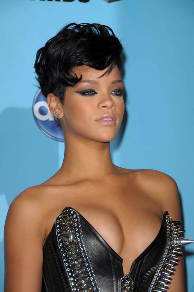 Rihanna looked edgy and cool in her spiked black leather bustier and raven pixie hair perfectly tousled for a wavy vintage look with a side-swept finish in the press room at the 2008 American Musica Awards in Los Angeles, CA.