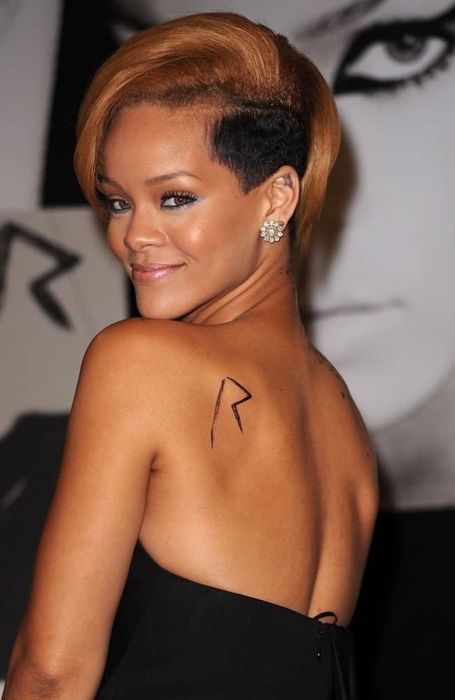 Rihanna at in-store appearance for Rihanna Promotes New Album RATED R at the Best Buy in New York City, NY on November 23, 2009. She flashed the fans with her lovely smile that worked quite well with her side-swept short hair with a shaved side.