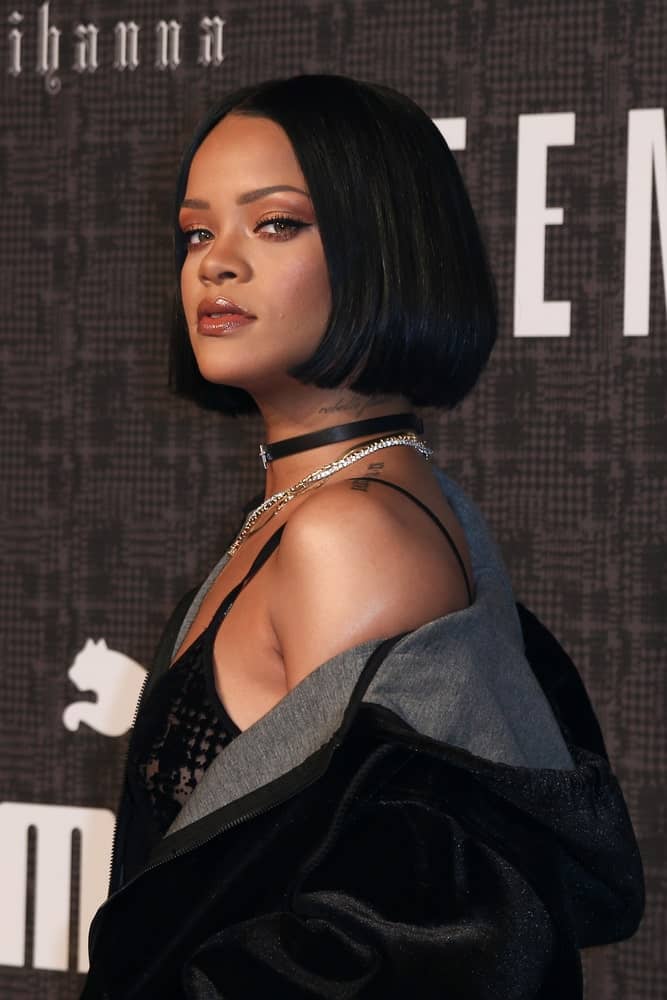 Recording artist Rihanna attended the FENTY PUMA by Rihanna AW16 Collection during Fall 2016 New York Fashion Week at 23 Wall Street on February 12, 2016 in New York City. She paired her casual black outfit with a short and straight bob hairstyle.