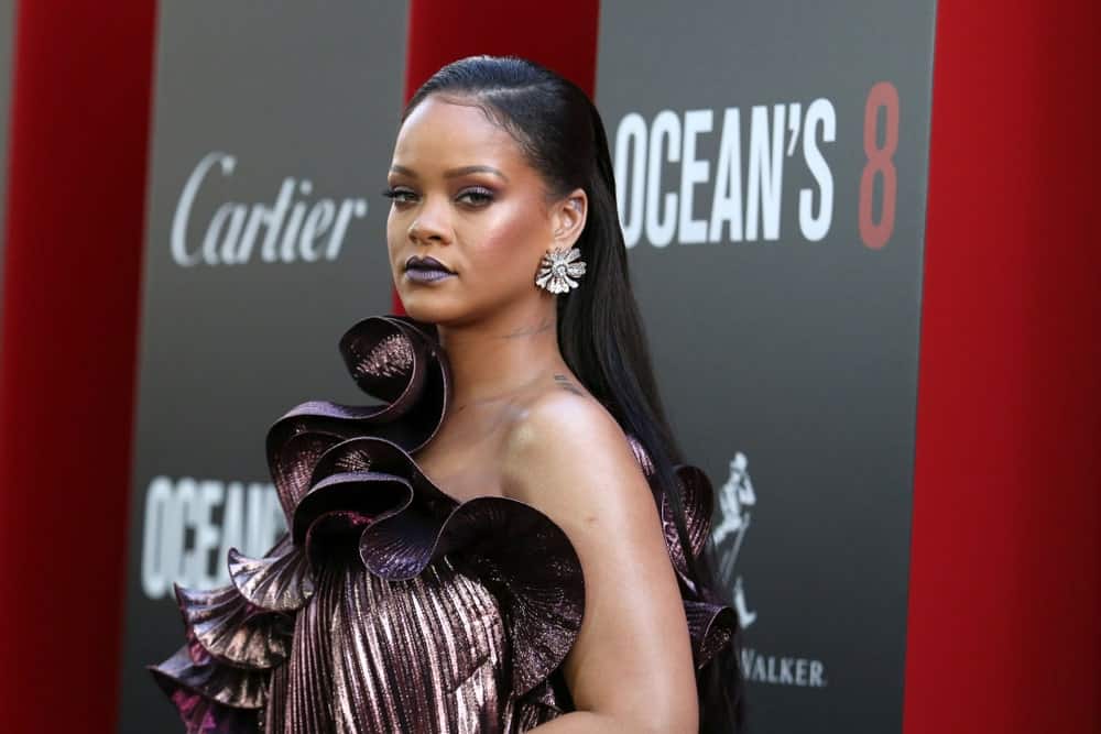 Rihanna attended the premiere of "Ocean's 8" at Alice Tully Hall on June 5, 2018, in New York City. She wore a fashion-forward dress that resembles a large flower and matched it with a long and slicked back jet black hairstyle.