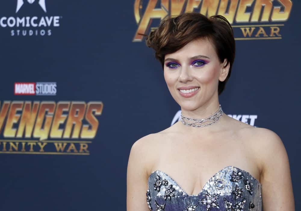Scarlett Johansson paired colorful eye shadow with her strapless silver sequined dress and side-swept short hairstyle with waves at the premiere of Disney and Marvel's 'Avengers: Infinity War' held at the El Capitan Theatre in Hollywood, USA on April 23, 2018.