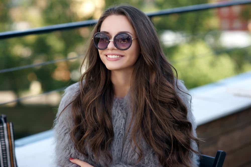 Young woman with long wavy brunette hair