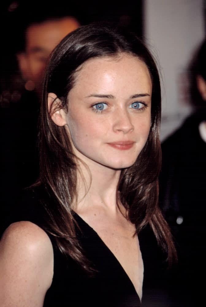 Alexis Bledel was at the premiere of The Importance of Being Earnest in New York City on May 13, 2002. She paired her black dress with a long and layered straight dark hairstyle tucked behind her ears.