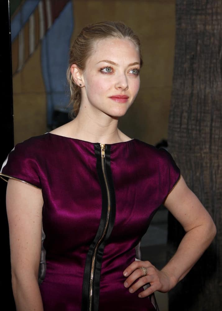 Amanda Seyfried attended the Los Angeles Premiere of "Mother and Child" held at the Egyptian Theater in Hollywood, California, United States on April 19, 2010. She wore a shiny purple dress that paired quite well with her slicked back low ponytail hairstyle.